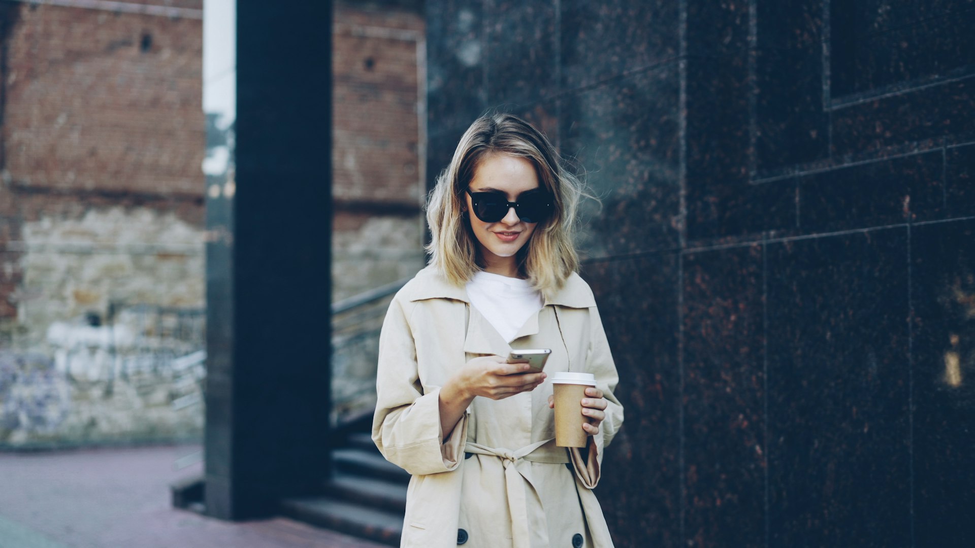 Person using Beequora app on phone